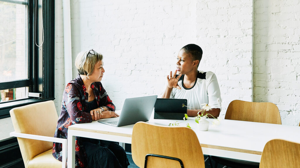 Two business women talking