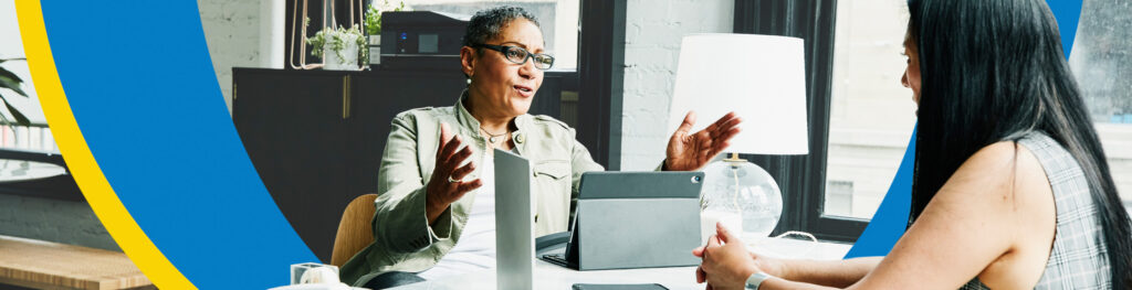 Two business women talking