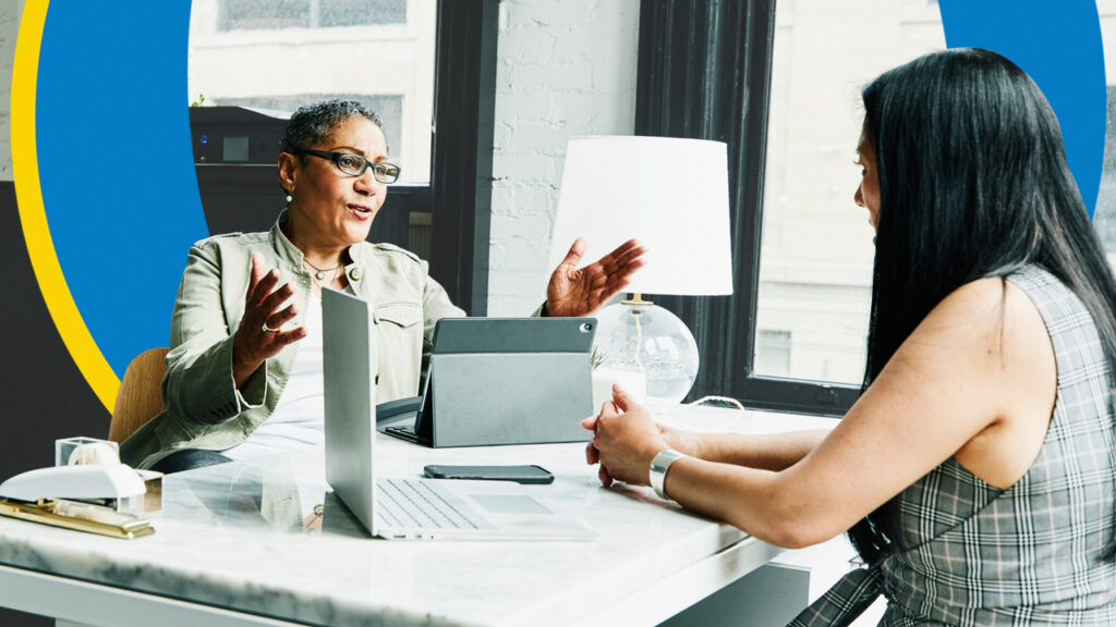 Two business women talking