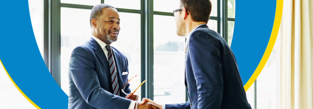 Two business men shaking hands