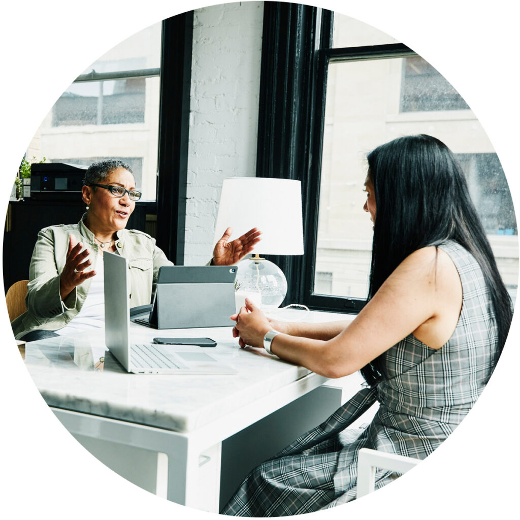 Two business women talking