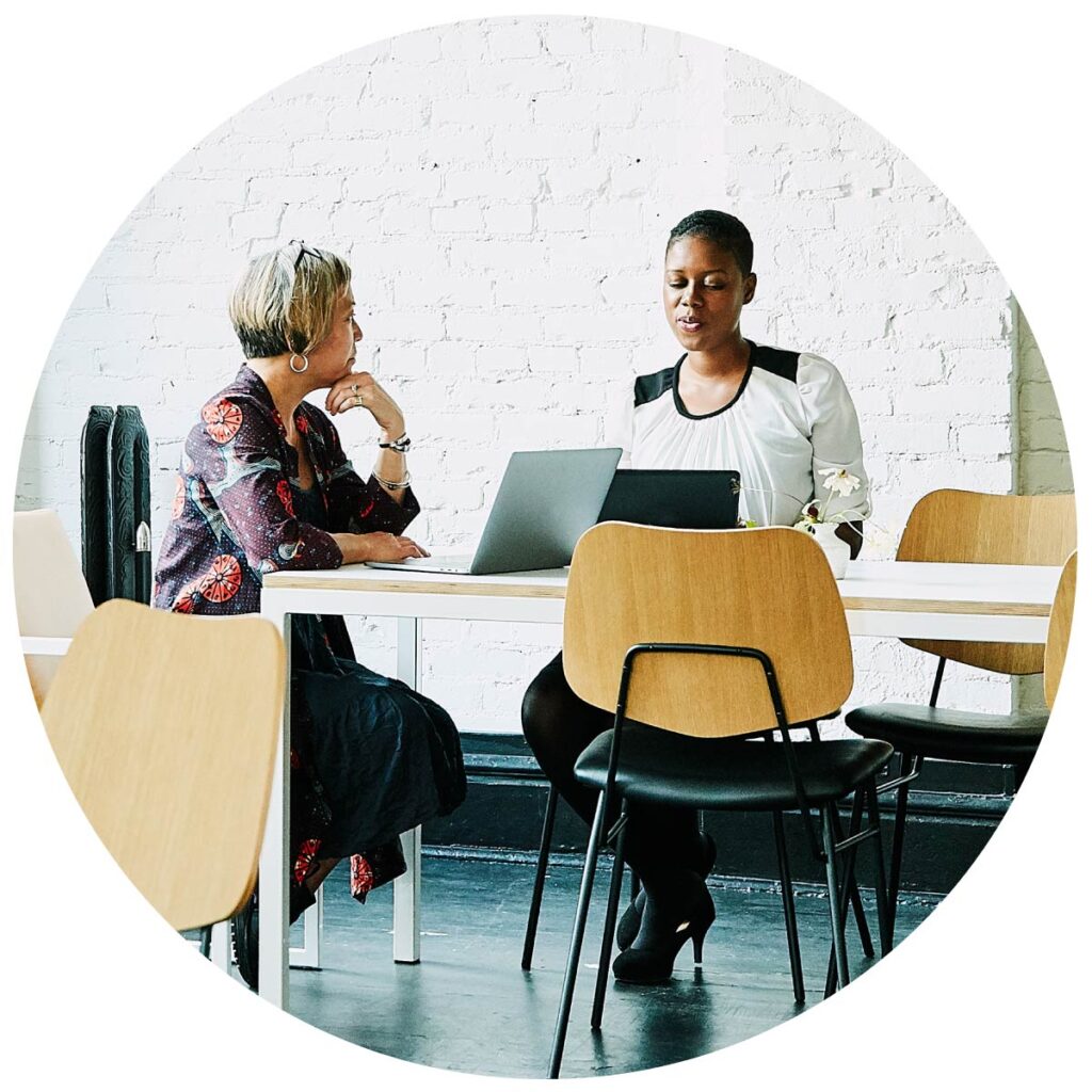 Two business women talking